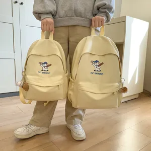 Cute cartoon canvas school backpack for teen girls, large capacity casual daily bag.