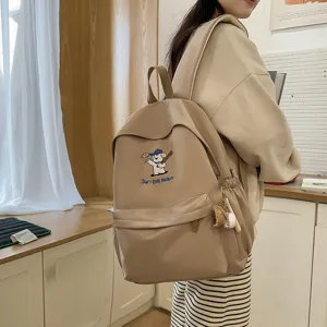 Cute canvas school backpack for teen girls, large capacity daypack with dog embroidery.