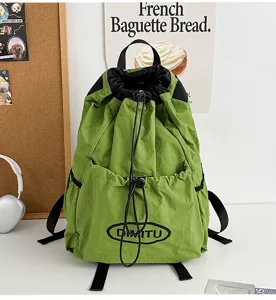 Lightweight green drawstring backpack, gorpcore style unisex casual daypack for outdoor sports travel.