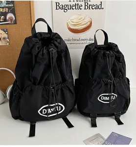 Detailed view of black nylon drawstring backpacks, outdoor sports casual lightweight travel bags.
