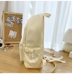 Minimalist beige canvas school backpack for students, casual daily casual daypack with side pockets.