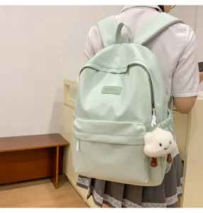 Mint green school backpack for student daily use, cute cloud pendant, casual daypack.
