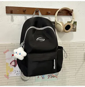 Mochila casual negra para estudiantes con bonito colgante de estrella y amplios bolsillos.