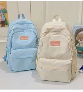Casual minimalist school backpack for teenage girls, lightweight aesthetic daypack, blue.