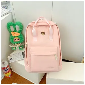 Pink canvas backpack casual daypack school bag with front pocket top handles daily use