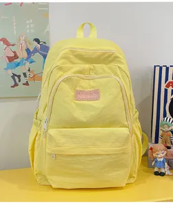 Casual yellow school backpack for student girls, lightweight daily laptop bookbag with multi pockets.