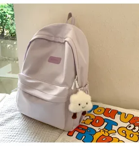 Casual minimalist solid color student backpack with cute plush cloud pendant for daily use.