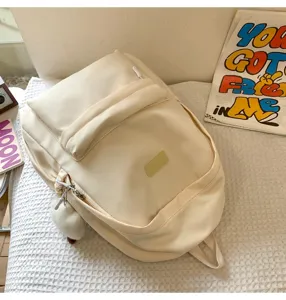 Simple solid color casual backpack for students and daily commuting, stylish and versatile design.