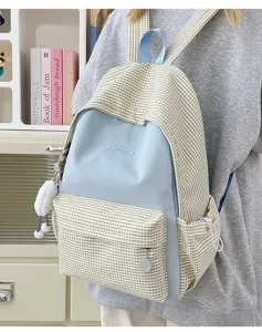 Details of the Japanese style plaid backpack with contrast blue panel and large capacity.