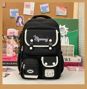 Japanese INS style large capacity black student school backpack with multi pockets and white trim.