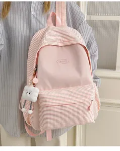 Pink and white plaid backpack for women, large capacity casual school bag for daily use.