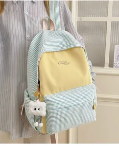 Japanese style aesthetic grid school backpack with yellow front pocket and cute cloud pendant.