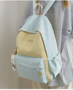 Japanese style plaid backpack for school and travel with large capacity and front pocket.