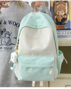 Mint green grid backpack for women, stylish student school bag with large capacity for travel.
