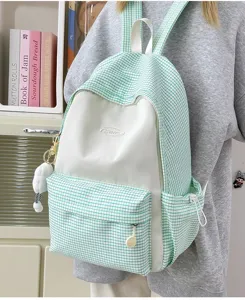 Detailed view of casual green and white plaid school backpack, perfect for daily use.