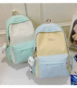 Cute Japanese style plaid backpack large capacity school bag for teenage girls and daily travel use.
