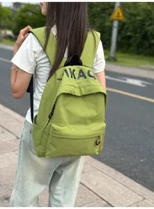 Casual green canvas backpack for women, Korean style lightweight school book bag with straps.