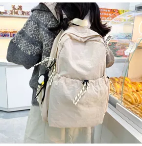 Solid color nylon backpack for women, large capacity school bag and lightweight travel daypack.