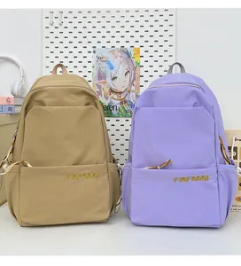 Casual student backpack detail showing spacious compartments, durable fabric in khaki and purple.