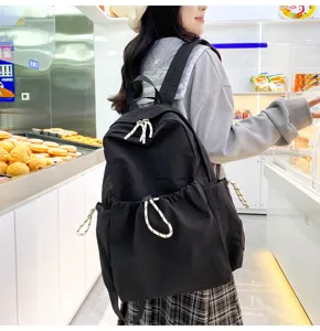 Solid color nylon backpack for women, large capacity school bag and lightweight travel daypack.