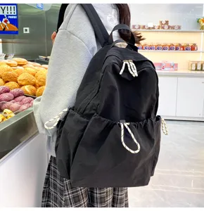 Solid color nylon backpack for women, large capacity casual daypack, lightweight travel bag.