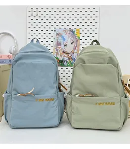 Casual canvas backpacks in blue and green, featuring front pocket and spacious design.