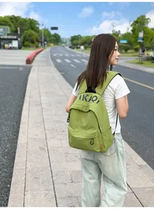 Korean style casual green backpack for college students, lightweight daily canvas school bag.
