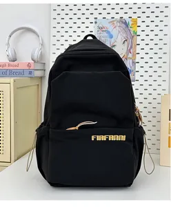 Detail view of a black casual school backpack, large capacity minimalist design for students.