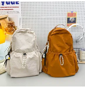 Solid color nylon backpack for women, large capacity school bag and casual travel daypack.