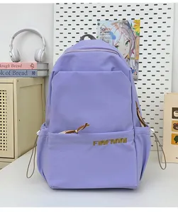 Detailed view of the minimalist purple student backpack with front pocket and durable fabric.