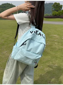 Casual light blue canvas school backpack detail view for students outdoor daily wear.
