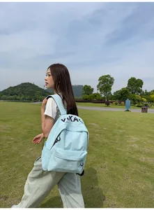 Detail shot of light blue casual student backpack showcasing stylish Korean design and fabric.