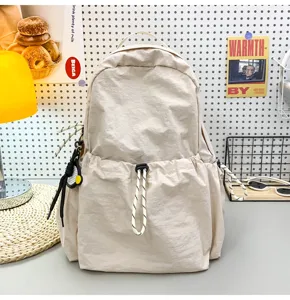 Casual beige nylon backpack for women, large capacity stylish school bag for daily travel.