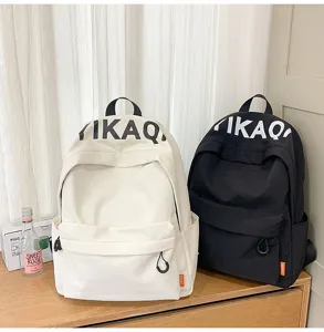 Casual Korean style canvas backpack with large capacity, durable fabric and clean dual color design.