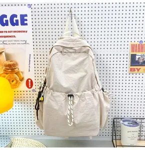Detail shot of solid color nylon backpack showing large capacity and daily casual style.