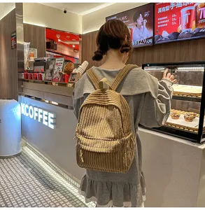 Casual corduroy backpack for women, solid color versatile school bag for daily use.