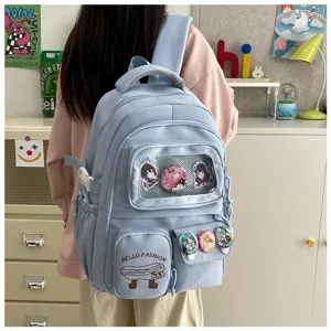 Cute Japanese style canvas backpack with transparent pocket and anime badges for students.