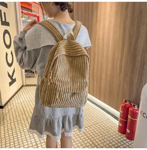 Casual corduroy backpack for women, stylish everyday school bag with spacious compartments.