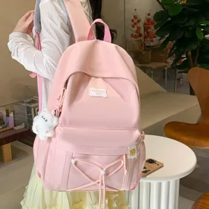 Japanese ins style pink casual school backpack for women, lightweight minimalist daily daypack.