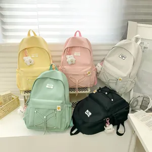 Japanese style casual solid color school backpack for women, simple and lightweight daily bag.