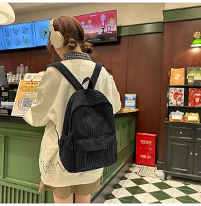 Casual black corduroy backpack for women and students, perfect for daily use and school life.
