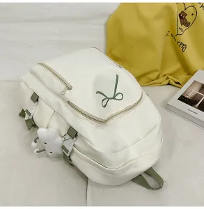 Japanese cute aesthetic white backpack for girls with green bow and plush pendant school bag