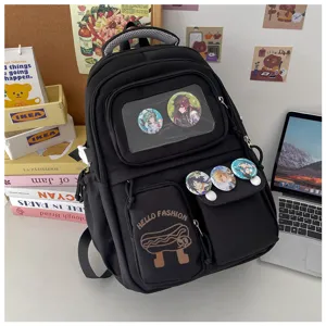 Japanese style black canvas backpack with transparent pocket and cute anime badges for school.