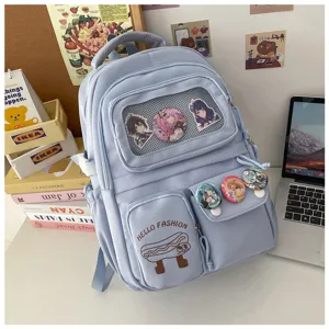 Light blue cute ita backpack large capacity school bag with anime badges and multiple pockets.
