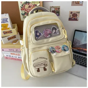 Cute Japanese style canvas backpack with clear front window and cute anime pins for students.