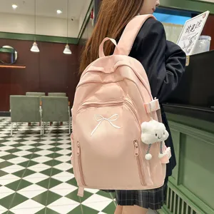 Cute pink Japanese style school backpack for teen girls, large capacity travel daypack.