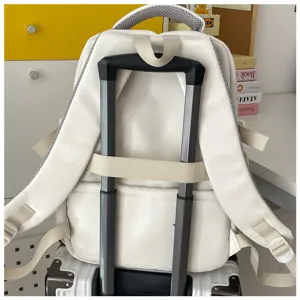 White large capacity student backpack with luggage strap, perfect for travel and daily commute.