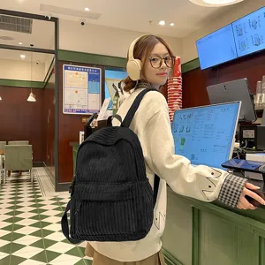 Solid color corduroy backpack for women, Korean style casual school bag for daily use.