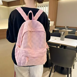 Pink checkerboard school backpack for teen girls, large capacity casual daypack daily use.