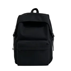 Casual black nylon backpack for daily school and travel, lightweight and spacious design.
